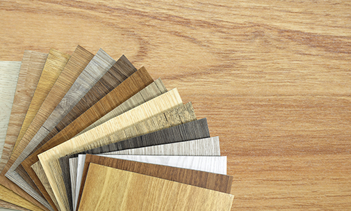 Samples Of Laminate And Vinyl Floor Tile On Wooden Background